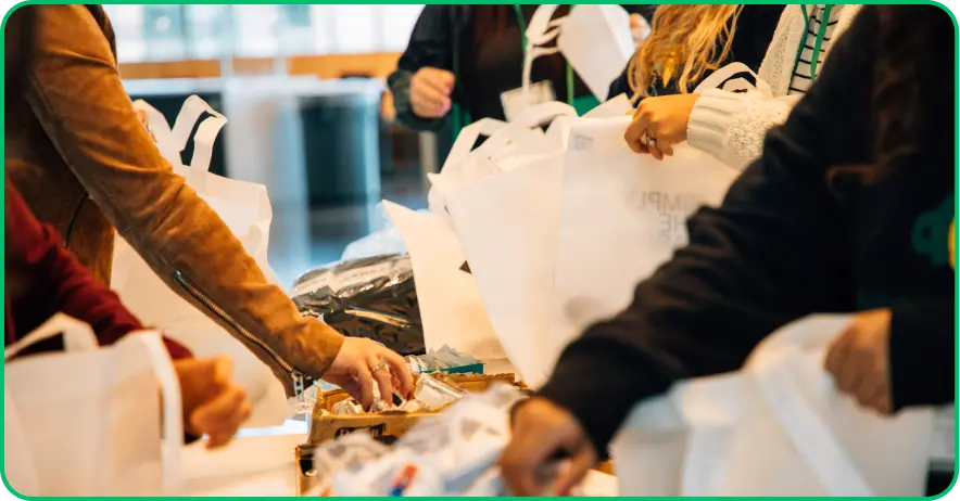 Group of people helping to pack supply bags